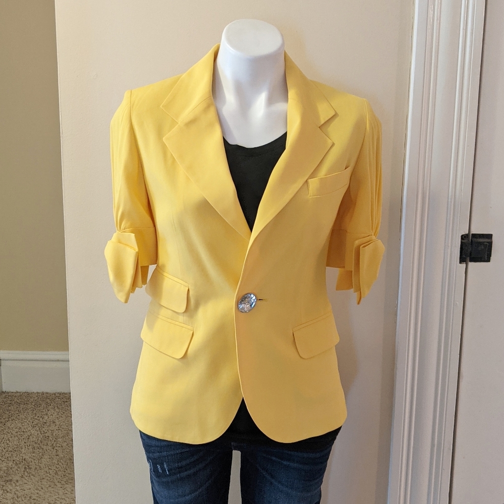 Sara Berman bright yellow bow sleeve blazer.